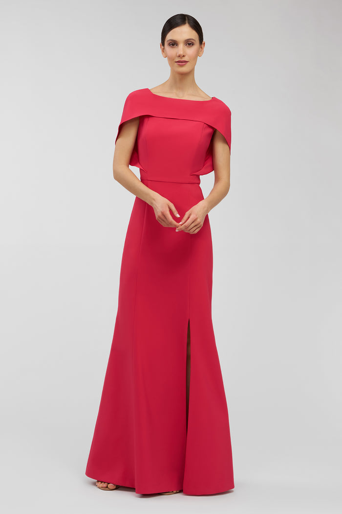 Woman wearing a pink evening gown on a white background